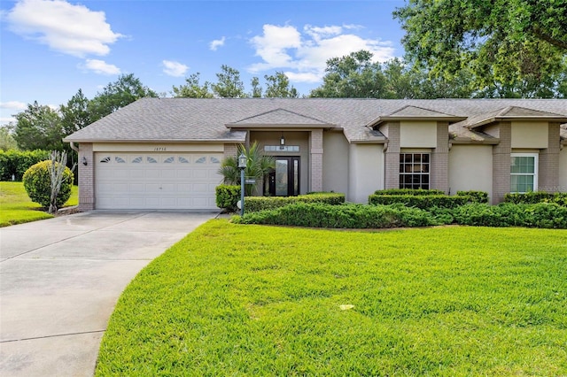 18736 Bent Pine Dr, Hudson, FL 34667 - view of front of property with brick siding, driveway, and a front yard