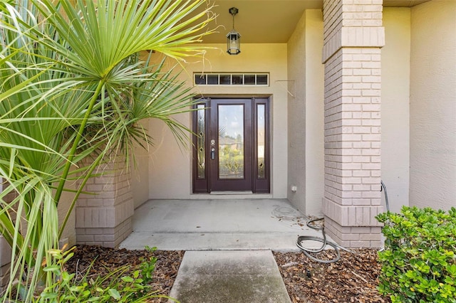 18736 Bent Pine Dr, Hudson, FL 34667 - entrance to property featuring stucco siding and brick siding