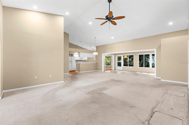 18736 Bent Pine Dr, Hudson, FL 34667 - unfurnished living room with a ceiling fan, high vaulted ceiling, light colored carpet, and recessed lighting