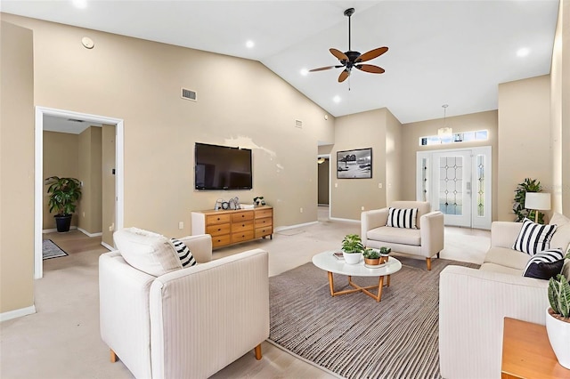 18736 Bent Pine Dr, Hudson, FL 34667 - living room featuring high vaulted ceiling, a ceiling fan, and light colored carpet