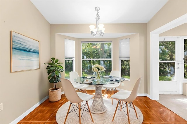 18736 Bent Pine Dr, Hudson, FL 34667 - dining area with a chandelier and baseboards
