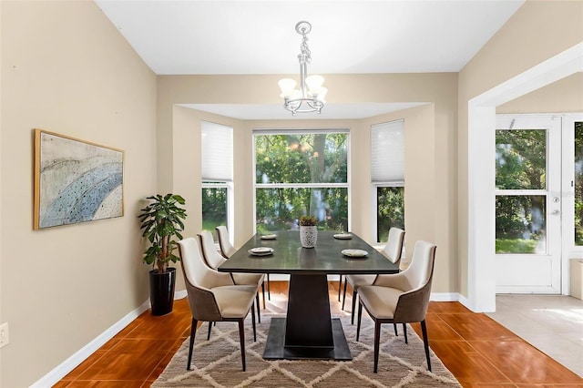 18736 Bent Pine Dr, Hudson, FL 34667 - dining room featuring a chandelier and wood finished floors