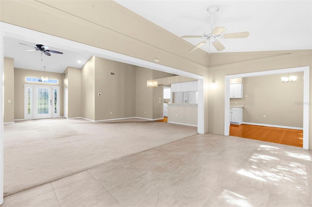 18736 Bent Pine Dr, Hudson, FL 34667 - unfurnished living room featuring a ceiling fan, light colored carpet, a chandelier, and vaulted ceiling