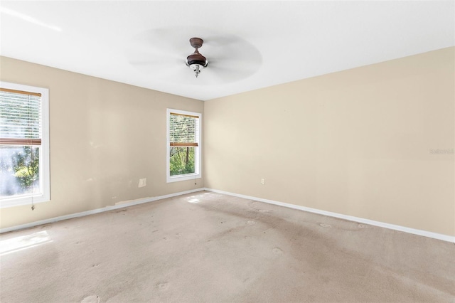 18736 Bent Pine Dr, Hudson, FL 34667 - carpeted spare room with baseboards and a ceiling fan