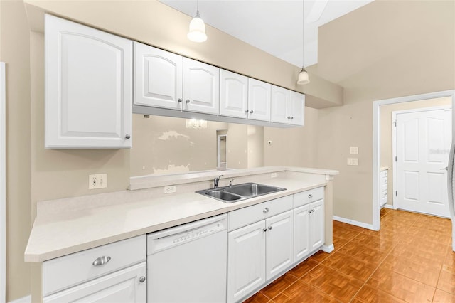 18736 Bent Pine Dr, Hudson, FL 34667 - kitchen featuring dishwasher, white cabinetry, decorative light fixtures, light countertops, and a peninsula