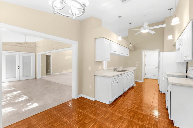 18736 Bent Pine Dr, Hudson, FL 34667 - kitchen with a ceiling fan, dishwasher, light countertops, white cabinetry, and high vaulted ceiling