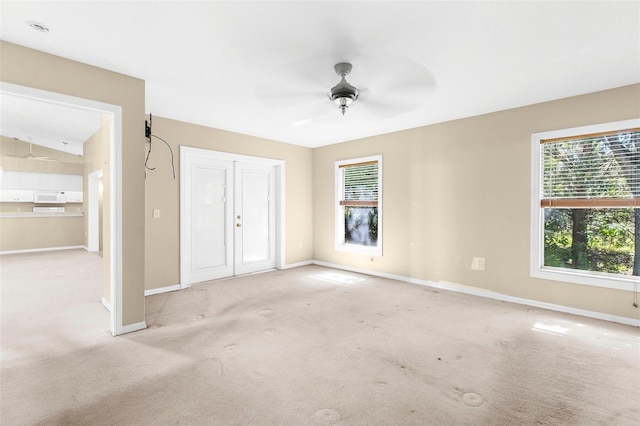 18736 Bent Pine Dr, Hudson, FL 34667 - unfurnished bedroom with multiple windows, carpet floors, and ceiling fan