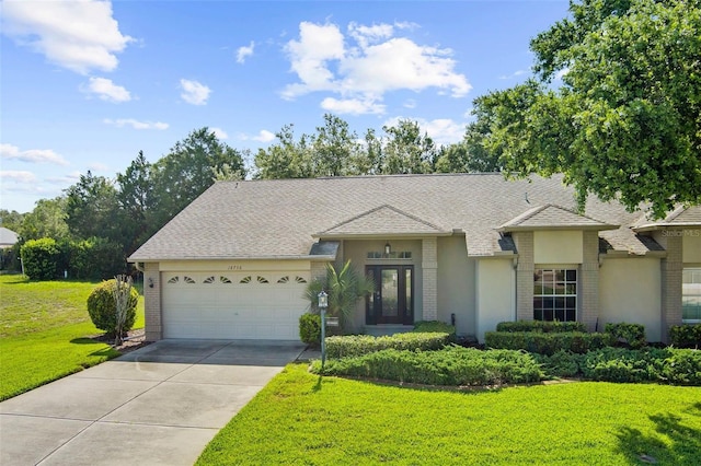 18736 Bent Pine Dr, Hudson, FL 34667 - view of front of property featuring brick siding, a garage, driveway, a front lawn, and roof with shingles
