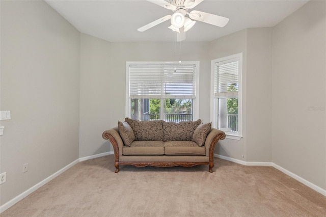 4052 Marine Pkwy, New Port Richey, FL 34652 - living area featuring light carpet and a ceiling fan