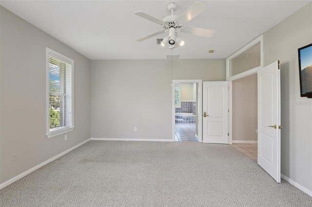 4052 Marine Pkwy, New Port Richey, FL 34652 - unfurnished bedroom with carpet and a ceiling fan