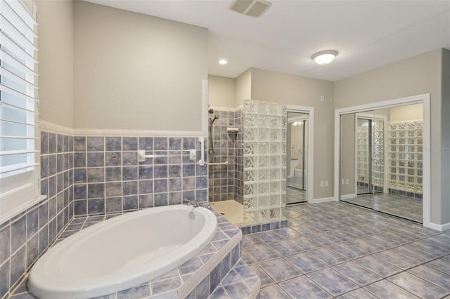 4052 Marine Pkwy, New Port Richey, FL 34652 - bathroom with a bath and a walk in shower