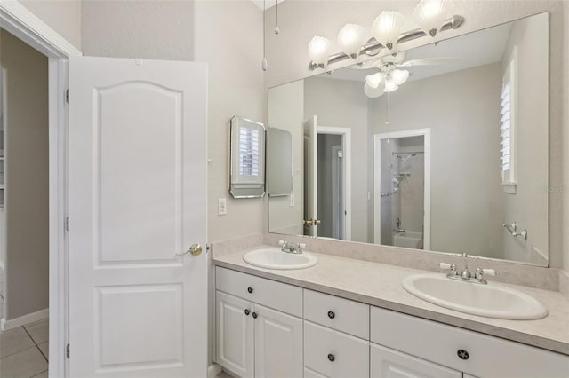 4052 Marine Pkwy, New Port Richey, FL 34652 - full bathroom featuring a shower, double vanity, ceiling fan, and tile patterned flooring