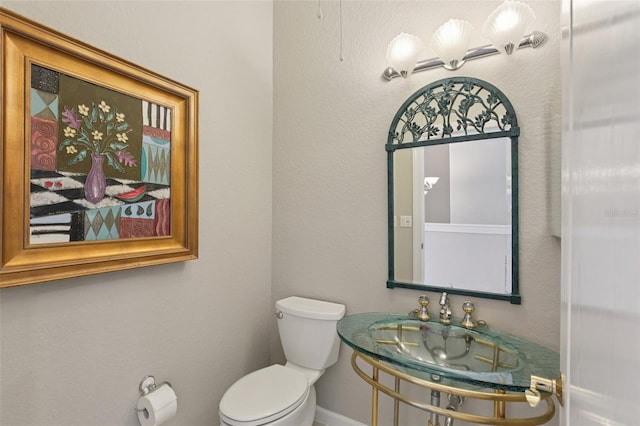 4052 Marine Pkwy, New Port Richey, FL 34652 - bathroom featuring toilet and baseboards