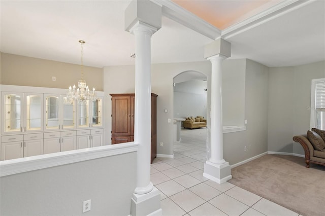 4052 Marine Pkwy, New Port Richey, FL 34652 - corridor with decorative columns, light tile patterned flooring, light colored carpet, and arched walkways