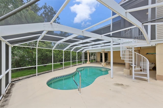 4052 Marine Pkwy, New Port Richey, FL 34652 - swimming pool featuring a patio area, stairs, and glass enclosure