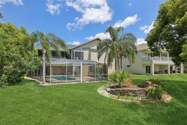 4052 Marine Pkwy, New Port Richey, FL 34652 - rear view of house with a yard, an outdoor pool, a patio, a lanai, and a balcony