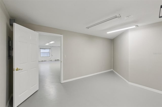 4052 Marine Pkwy, New Port Richey, FL 34652 - unfurnished room with concrete floors and baseboards