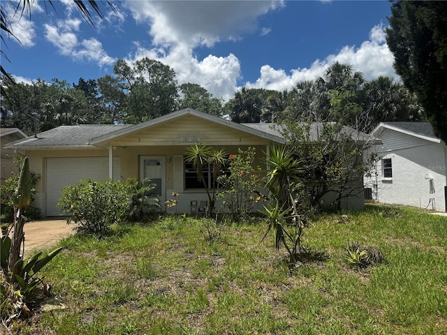 6826 Driftwood Dr, Hudson, FL 34667 - view of front of property featuring a garage and driveway