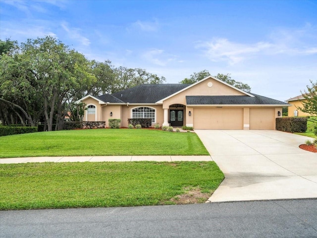 12060 Sapphire Dr, Spring Hill, FL 34609 - ranch-style home featuring stucco siding, driveway, a front yard, and a garage