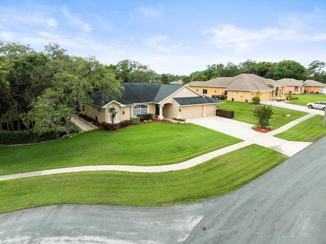 12060 Sapphire Dr, Spring Hill, FL 34609 - ranch-style house featuring an attached garage, driveway, a front yard, and stucco siding