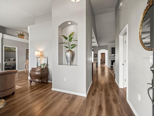 12060 Sapphire Dr, Spring Hill, FL 34609 - corridor with wood finished floors and a towering ceiling