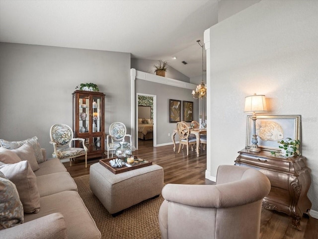 12060 Sapphire Dr, Spring Hill, FL 34609 - living area with lofted ceiling, wood finished floors, and a chandelier