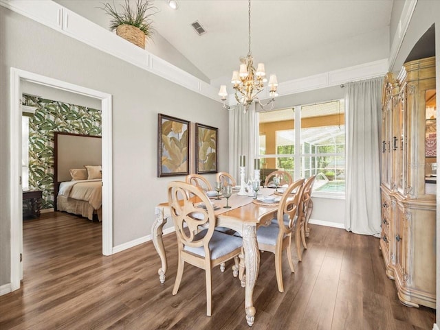 12060 Sapphire Dr, Spring Hill, FL 34609 - dining space featuring lofted ceiling, a chandelier, and dark wood-style floors