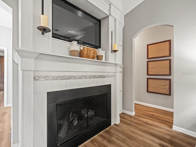 12060 Sapphire Dr, Spring Hill, FL 34609 - detailed view of a tile fireplace and wood finished floors