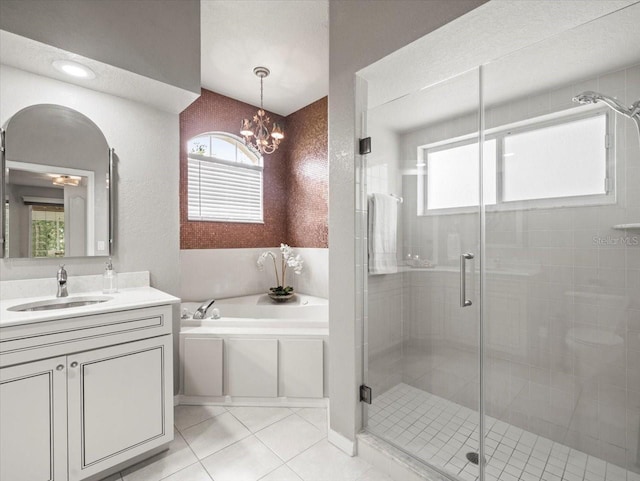 12060 Sapphire Dr, Spring Hill, FL 34609 - full bath with a garden tub, vanity, a stall shower, tile patterned floors, and a chandelier