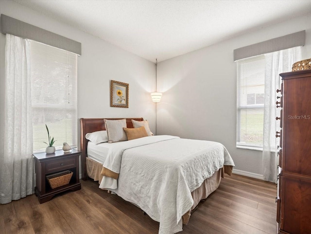 12060 Sapphire Dr, Spring Hill, FL 34609 - bedroom featuring wood finished floors and baseboards