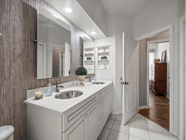 12060 Sapphire Dr, Spring Hill, FL 34609 - bathroom with double vanity and tile patterned floors