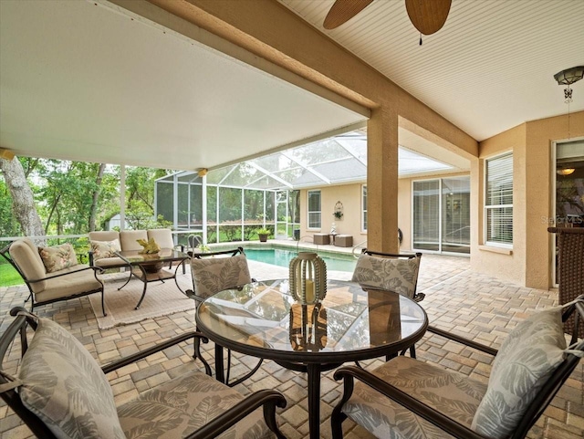 12060 Sapphire Dr, Spring Hill, FL 34609 - view of patio featuring an outdoor hangout area, a ceiling fan, an outdoor pool, glass enclosure, and outdoor dining space