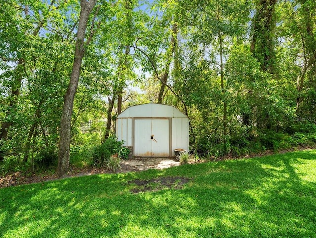 12060 Sapphire Dr, Spring Hill, FL 34609 - view of green lawn with a shed