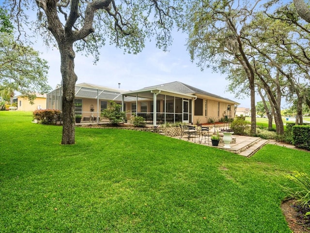 12060 Sapphire Dr, Spring Hill, FL 34609 - back of property with a lawn, a patio, a lanai, and stucco siding