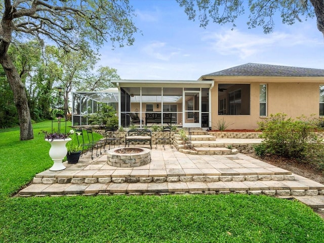 12060 Sapphire Dr, Spring Hill, FL 34609 - back of property with a fire pit, a yard, a patio area, stucco siding, and a sunroom