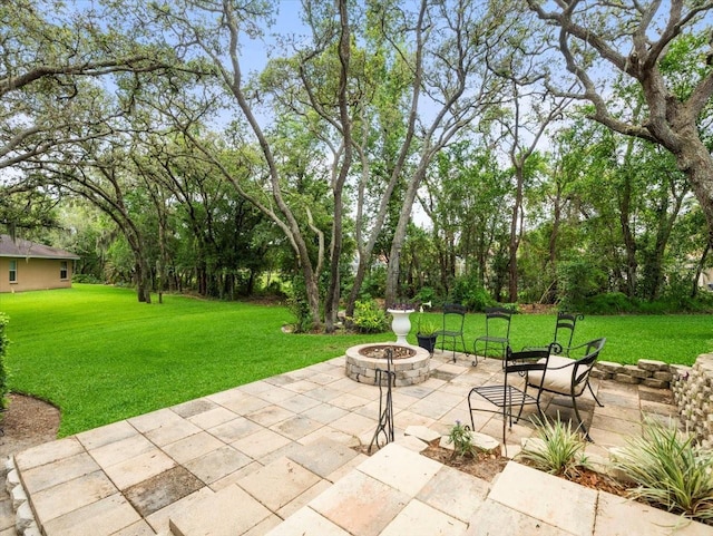 12060 Sapphire Dr, Spring Hill, FL 34609 - view of patio / terrace featuring a fire pit