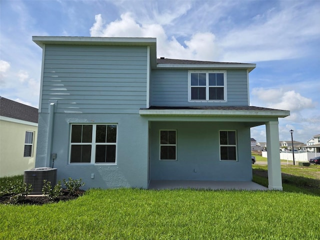 14425 Maiden Ter, Lakewood Ranch, FL 34211 - back of house featuring a yard, a patio area, stucco siding, and roof with shingles