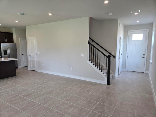 14425 Maiden Ter, Lakewood Ranch, FL 34211 - unfurnished living room featuring stairs, recessed lighting, and light tile patterned floors