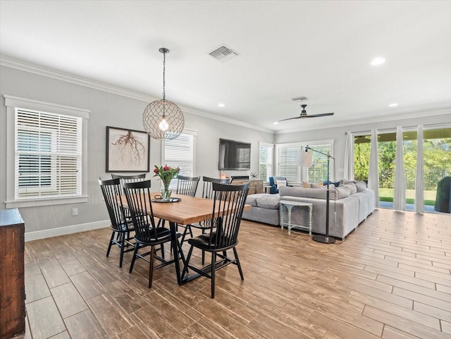 6130 Colmar Pl, Apollo Beach, FL 33572 - dining room with wood finished floors, ornamental molding, recessed lighting, and a ceiling fan
