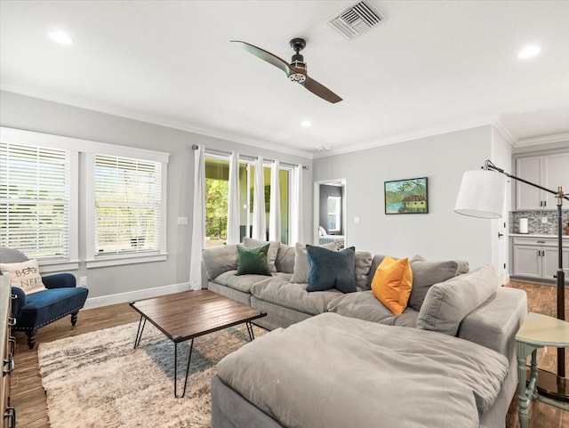 6130 Colmar Pl, Apollo Beach, FL 33572 - living room featuring ornamental molding, a ceiling fan, recessed lighting, and wood finished floors