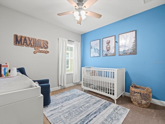 6130 Colmar Pl, Apollo Beach, FL 33572 - bedroom with a nursery area, carpet, and ceiling fan