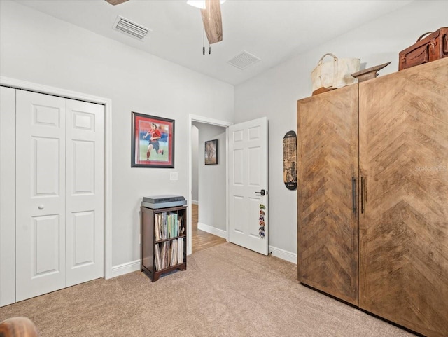 6130 Colmar Pl, Apollo Beach, FL 33572 - bedroom featuring light carpet, ceiling fan, and a closet