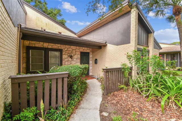 2101 Sunset Point Rd Unit 201, Clearwater, FL 33765 - view of exterior entry with brick siding