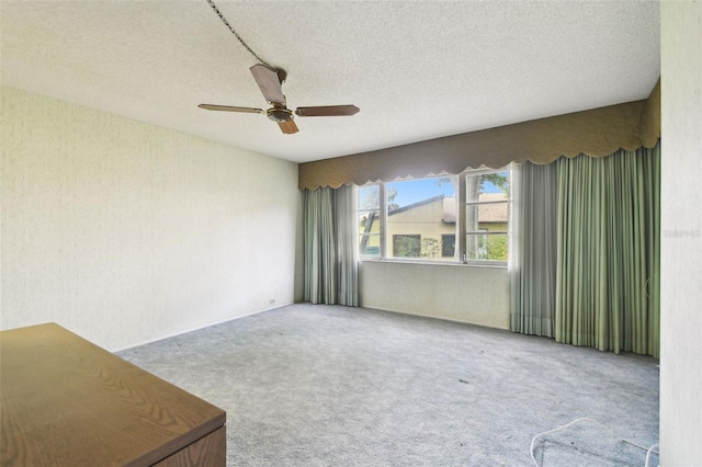 2101 Sunset Point Rd Unit 201, Clearwater, FL 33765 - spare room with carpet, a ceiling fan, and a textured ceiling