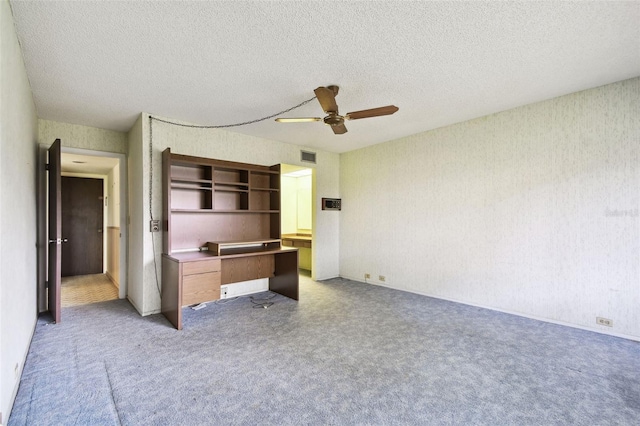 2101 Sunset Point Rd Unit 201, Clearwater, FL 33765 - unfurnished office featuring ceiling fan, a textured ceiling, light colored carpet, and wallpapered walls