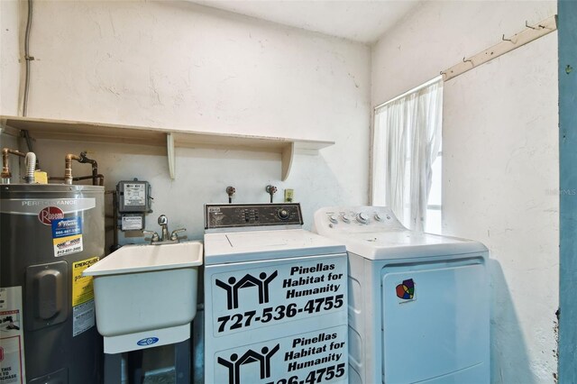 2101 Sunset Point Rd Unit 201, Clearwater, FL 33765 - washroom with electric water heater and washer and dryer