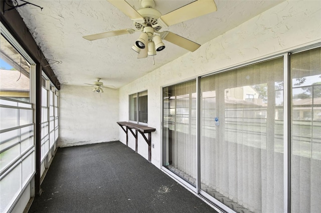 2101 Sunset Point Rd Unit 201, Clearwater, FL 33765 - unfurnished sunroom with a ceiling fan