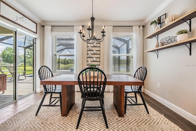 1783 Oak Hammock Ct, Lutz, FL 33558 - dining room featuring ornamental molding, a chandelier, and wood finished floors