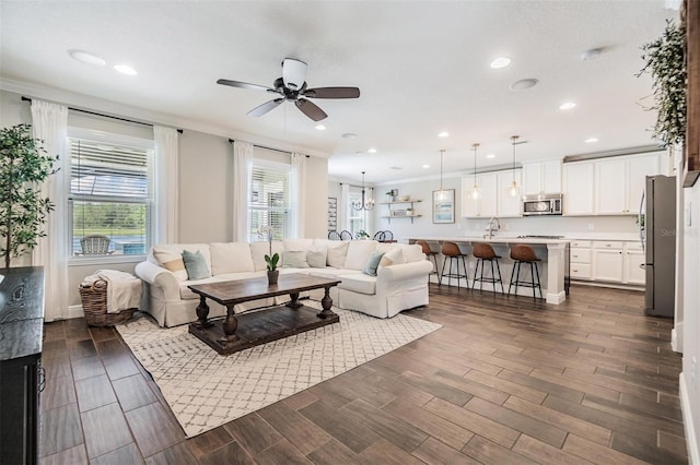 1783 Oak Hammock Ct, Lutz, FL 33558 - living room with ornamental molding, ceiling fan, dark wood-style floors, and recessed lighting