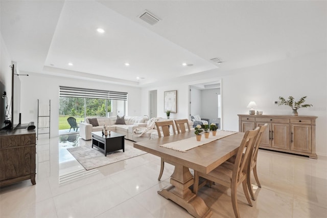 33466 Landsman Loop, Wesley Chapel, FL 33543 - dining space featuring a raised ceiling, recessed lighting, and light tile patterned floors